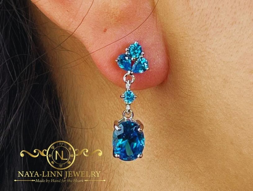 Claire Drop Earrings | Rhodium Over 925 Sterling Silver | Oval Cut Cubic Zirconia | Sapphire Blue