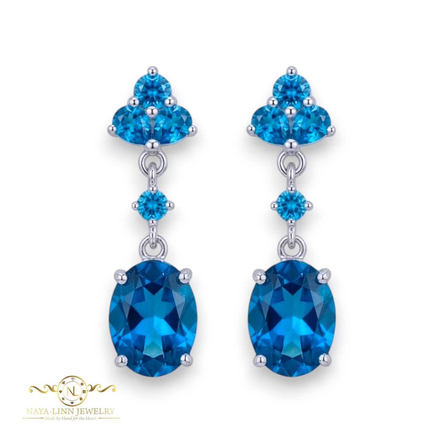 Claire Drop Earrings | Rhodium Over 925 Sterling Silver | Oval Cut Cubic Zirconia | Sapphire Blue